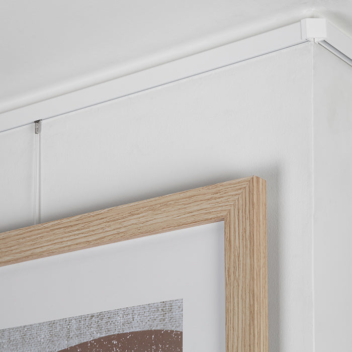 STAS minirail: système discret pour exposer peintures et art.
